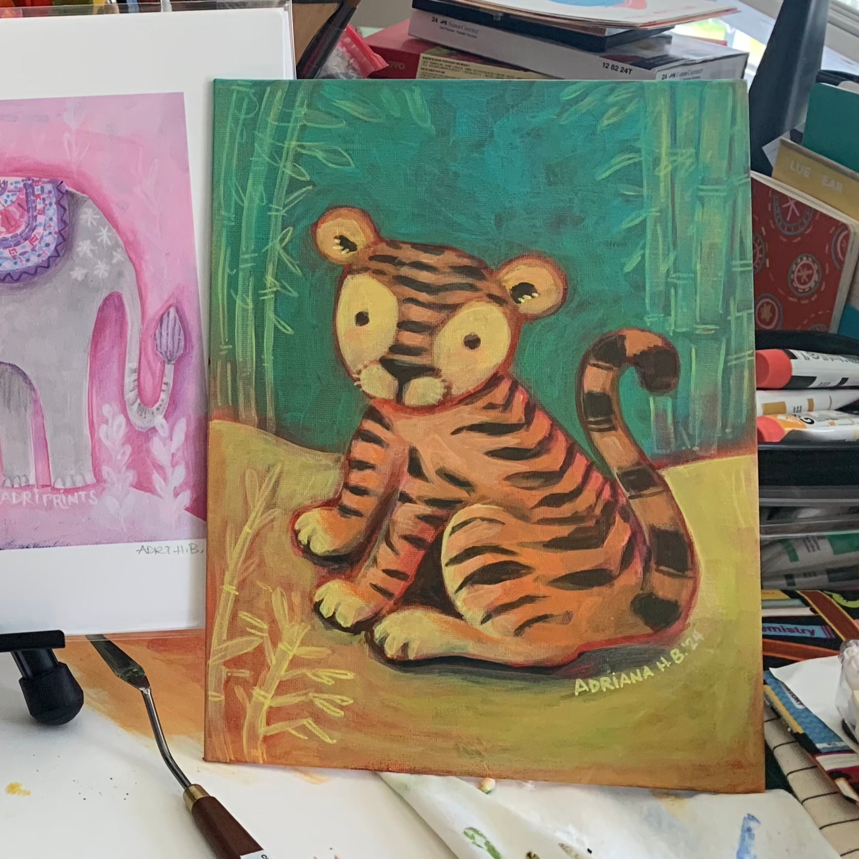 baby tiger sits painting in acrylic by adriana hernandez bergstrom